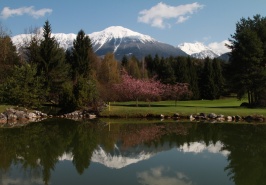 Slovenia and the greenest golf in Europe Golf swings with a mountain, lake and forest view